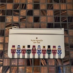 Kate Spade Festive Nutcracker Wristlet in Cream